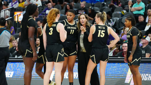 Colorado Buffaloes head coach JR Payne talks to players before a free throw against the LSU Lady Tigers during the fourth quarter at T-Mobile Arena